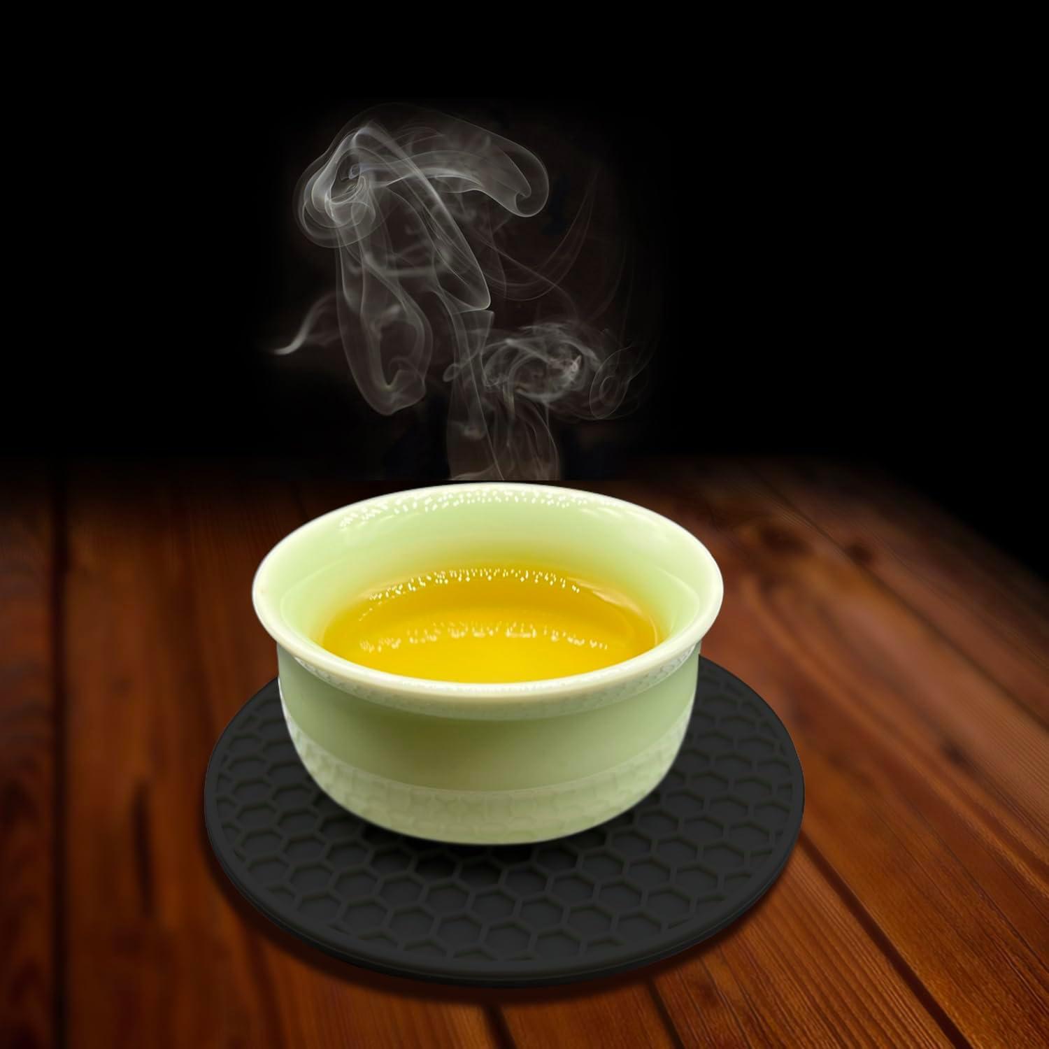 imageTENOC Silicone NonSlip Heat Resistant amp WaterTrapping Trivet Mats for Water Glasses amp Teacup amp Coffee Cup amp Dishes amp Cookware Multipurpose Kitchen Table Coaster 35Inch BlackBlack